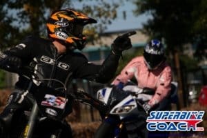 Student follows coach during track session in the cornering school